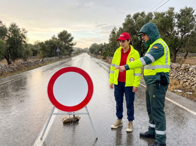 Riley talks to a Guardia Civil officer about the importance of the R-101 road sign in Spain.