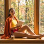 Riley Reads in a window during autumn